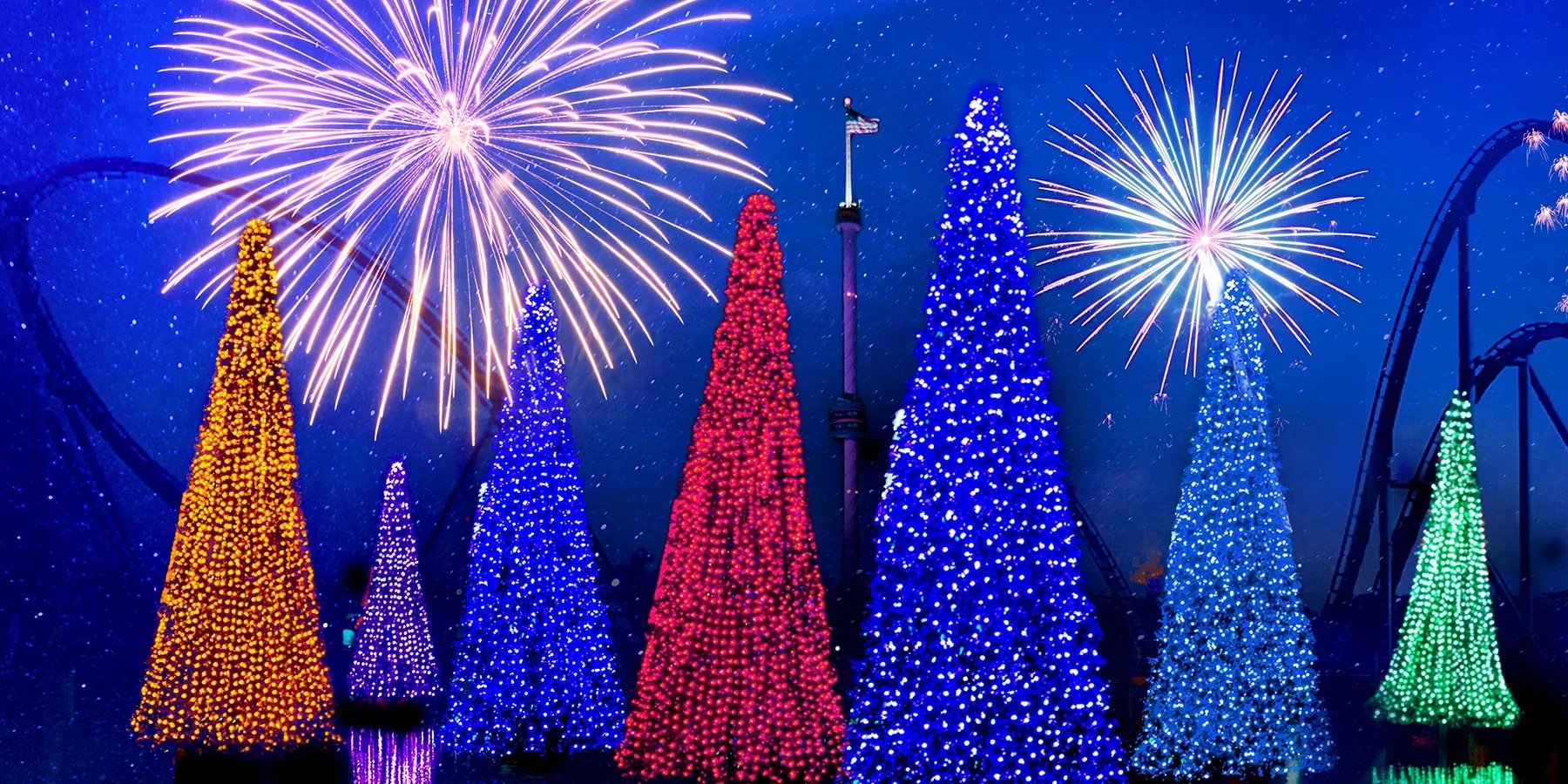 seaworld colorful christmas trees with blue background and fireworks
